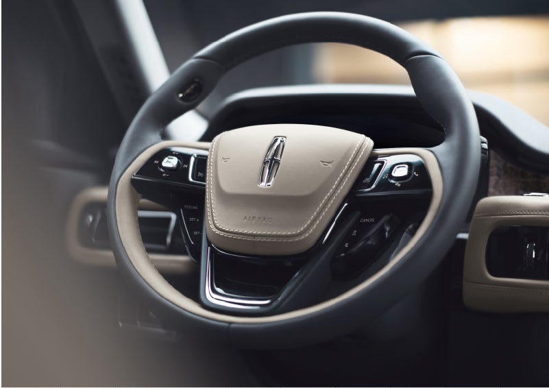 The intuitively placed controls of the steering wheel on a 2023 Lincoln Aviator® SUV | Irwin Lincoln Laconia in Laconia NH