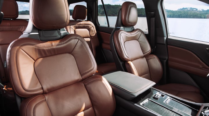 The front row's Perfect Position Seats in a 2024 Lincoln Aviator® Reserve model with Ebony Roast interior | Irwin Lincoln Laconia in Laconia NH