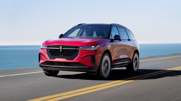 A 2024 Lincoln Nautilus® SUV is being driven on a seaside roadway. | Irwin Lincoln Laconia in Laconia NH