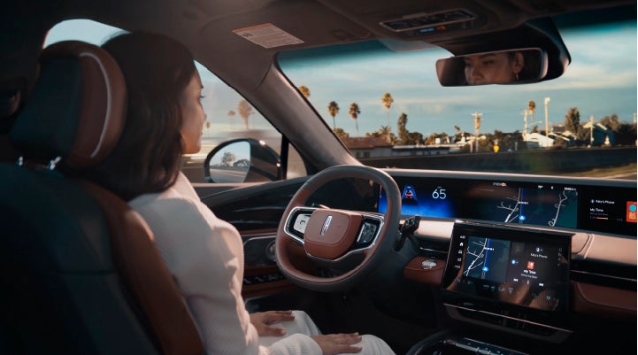 A person is shown driving hands-free on the highway with available Lincoln BlueCruise technology. | Irwin Lincoln Laconia in Laconia NH