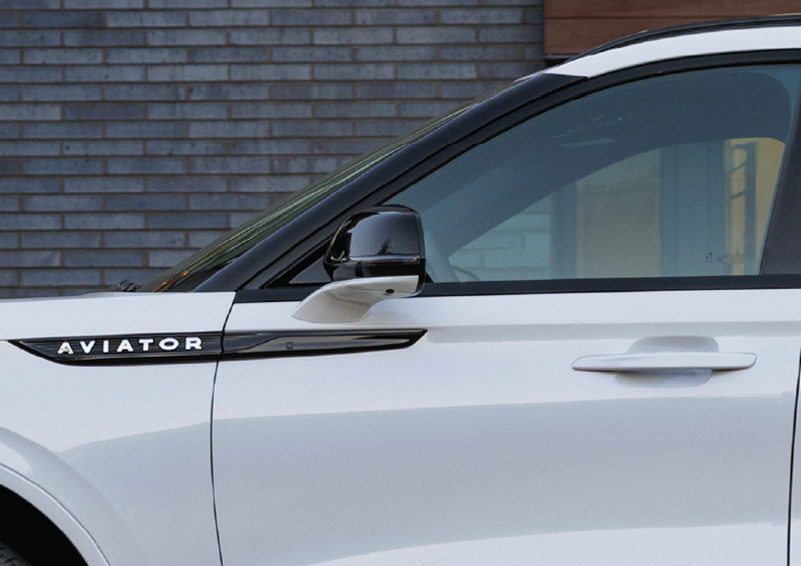 The driver’s door of a white 2025 Lincoln Aviator® SUV is showcased. | Irwin Lincoln Laconia in Laconia NH