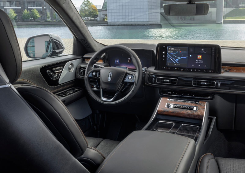 The interior of the 2025 Lincoln Aviator® SUV is shown parked with a view of a harbor through the windshield. | Irwin Lincoln Laconia in Laconia NH