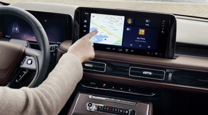 A person is tapping the center display touchscreen of a 2026 Lincoln Aviator® SUV. | Irwin Lincoln Laconia in Laconia NH
