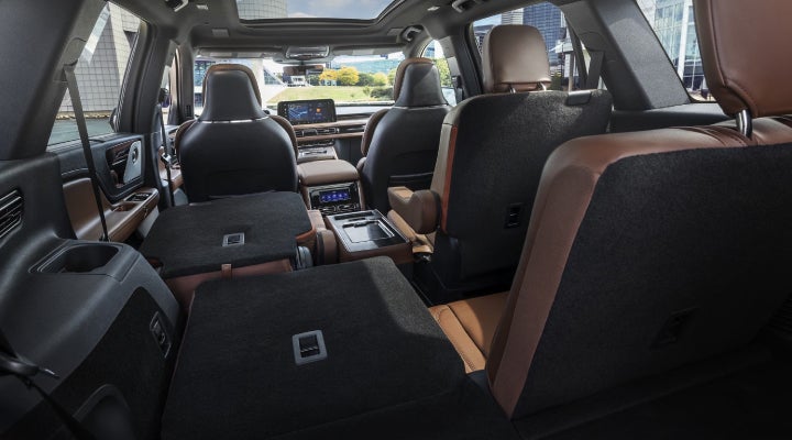 One side of the PowerFold® third-row seat and a second-row seat are folded forward in the 2026 Lincoln Aviator® SUV. | Irwin Lincoln Laconia in Laconia NH