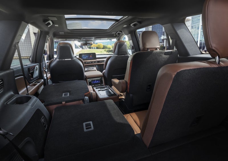 One side of the PowerFold® third-row seat and a second-row seat are folded forward in the 2026 Lincoln Aviator® SUV. | Irwin Lincoln Laconia in Laconia NH