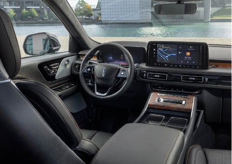 The interior of the 2026 Lincoln Aviator® SUV is shown parked with a view of a harbor through the windshield. | Irwin Lincoln Laconia in Laconia NH