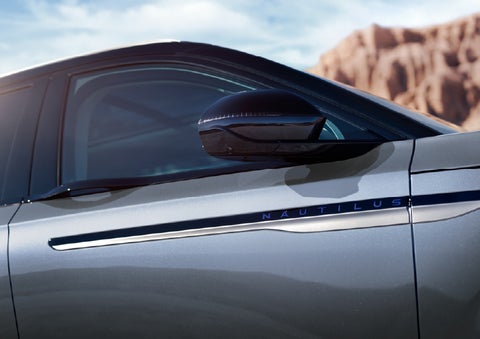 Blue lettering on the side of the vehicle that reads Nautilus indicates the available Hybrid Powertrain. | Irwin Lincoln Laconia in Laconia NH