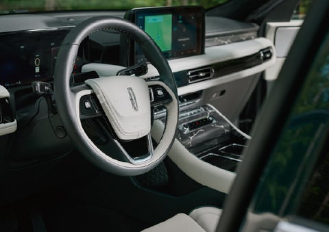 The leather-trimmed steering wheel of a 2027 Lincoln Aviator® Black Label™ SUV. | Irwin Lincoln Laconia in Laconia NH